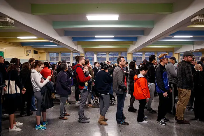 People wait in line to vote at a polling site at Public School 261 (Getty Images)